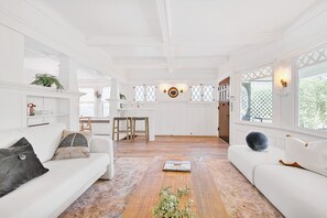 Smart TV, fireplace, books, computer monitors