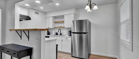 Oven, stovetop, coffee/tea maker, cookware/dishes/utensils