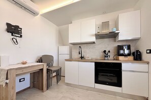 Penthouse, vista al mar | Cocina privada