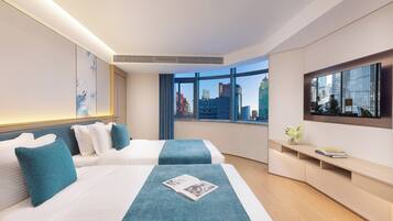 Deluxe Apartment, 1 Bedroom (Twin) | Down duvets, desk, blackout curtains, iron/ironing board