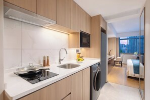 Executive Studio | Down comforters, desk, blackout drapes, iron/ironing board