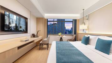 Executive Studio | Down comforters, desk, blackout drapes, iron/ironing board