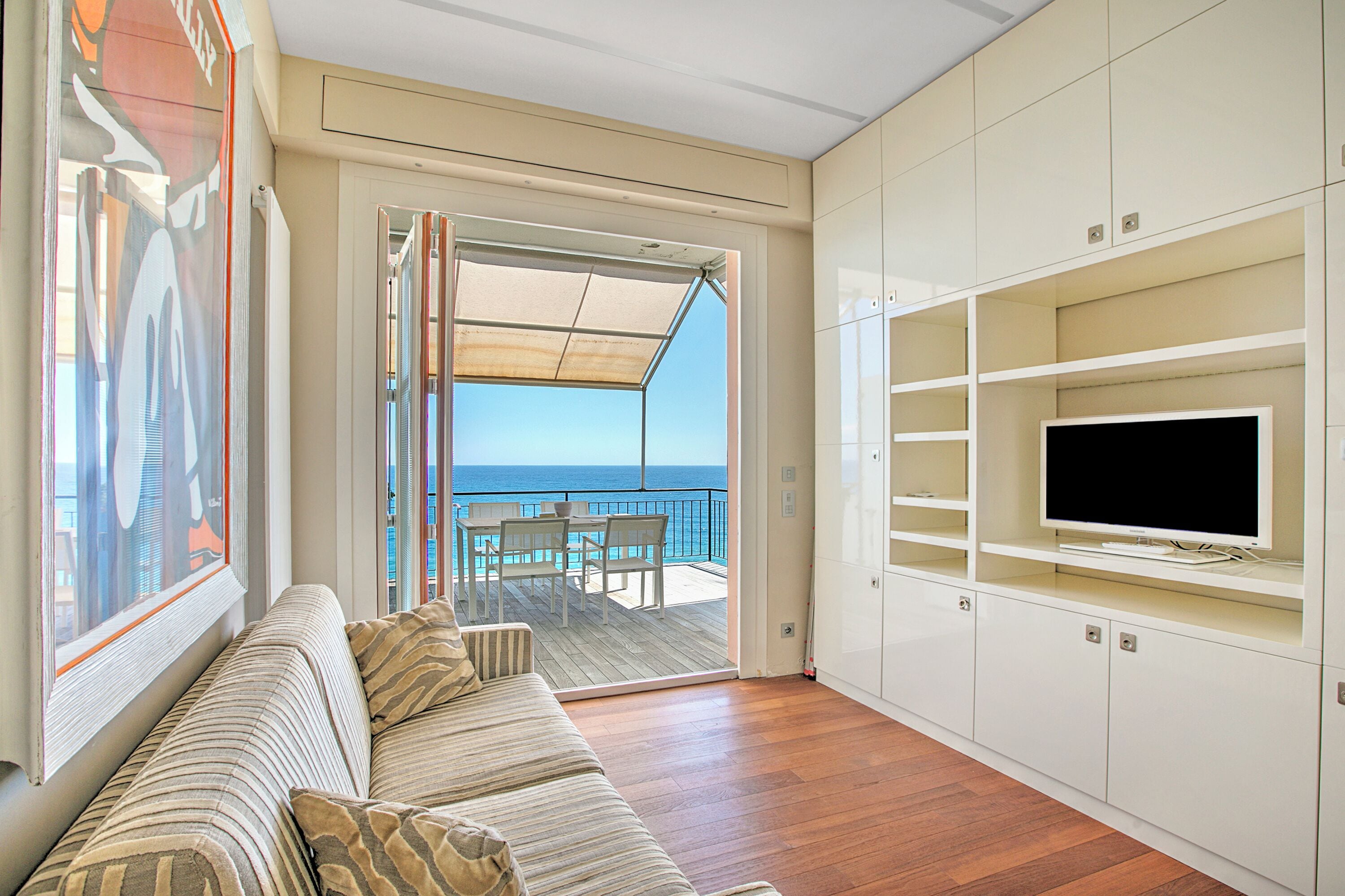 Standard Apartment, Multiple Bedrooms, 2 Bathrooms, Sea Facing (Il Faro Sul Mare - Total Sea View) | Living area | 21-inch flat-screen TV with satellite channels