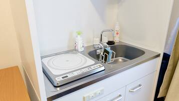 Fridge, microwave, cookware/dishes/utensils