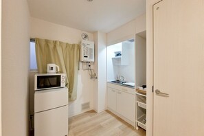 Fridge, microwave, cookware/dishes/utensils