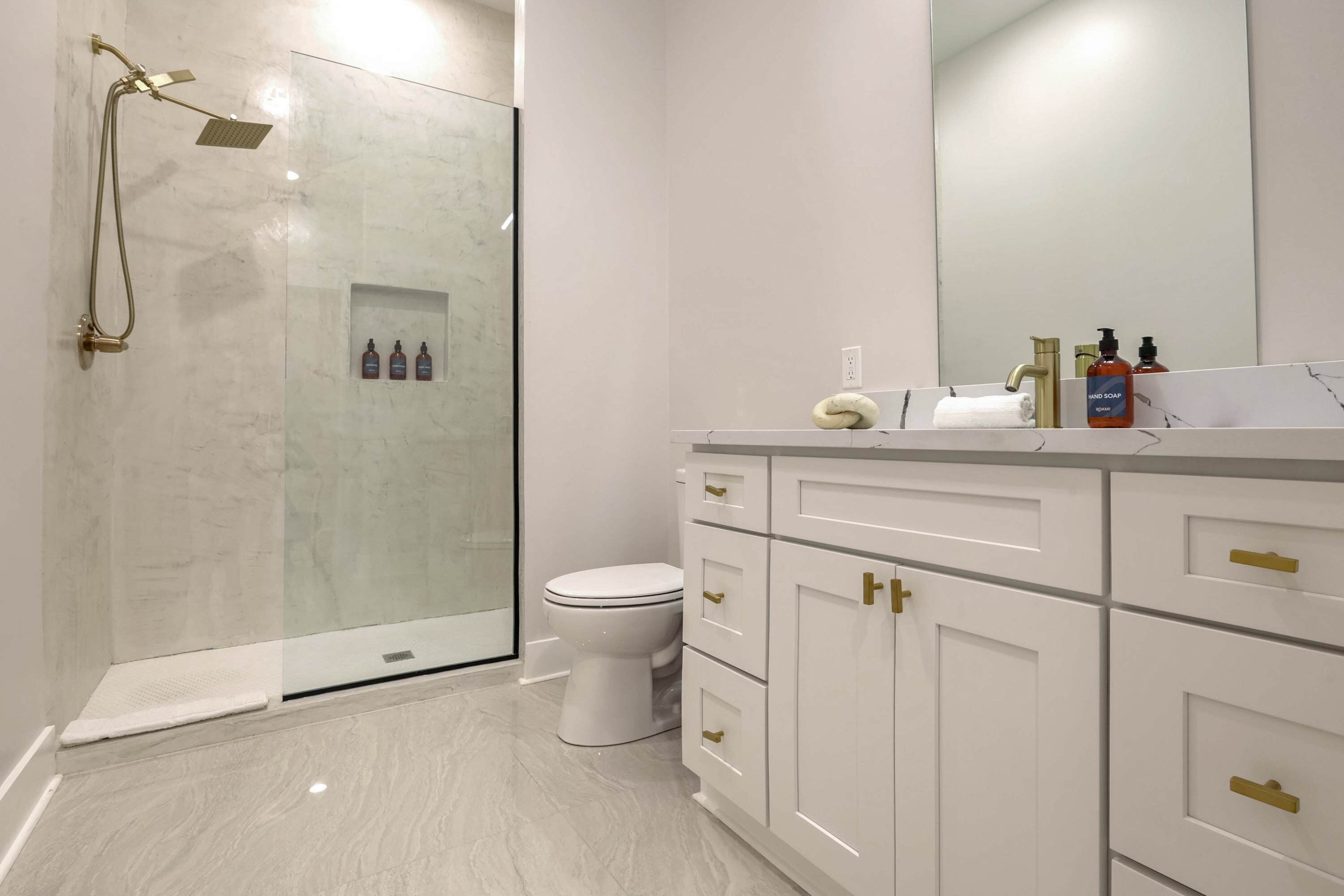 Shower, hair dryer, towels, shampoo