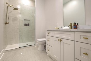 Shower, hair dryer, towels, shampoo