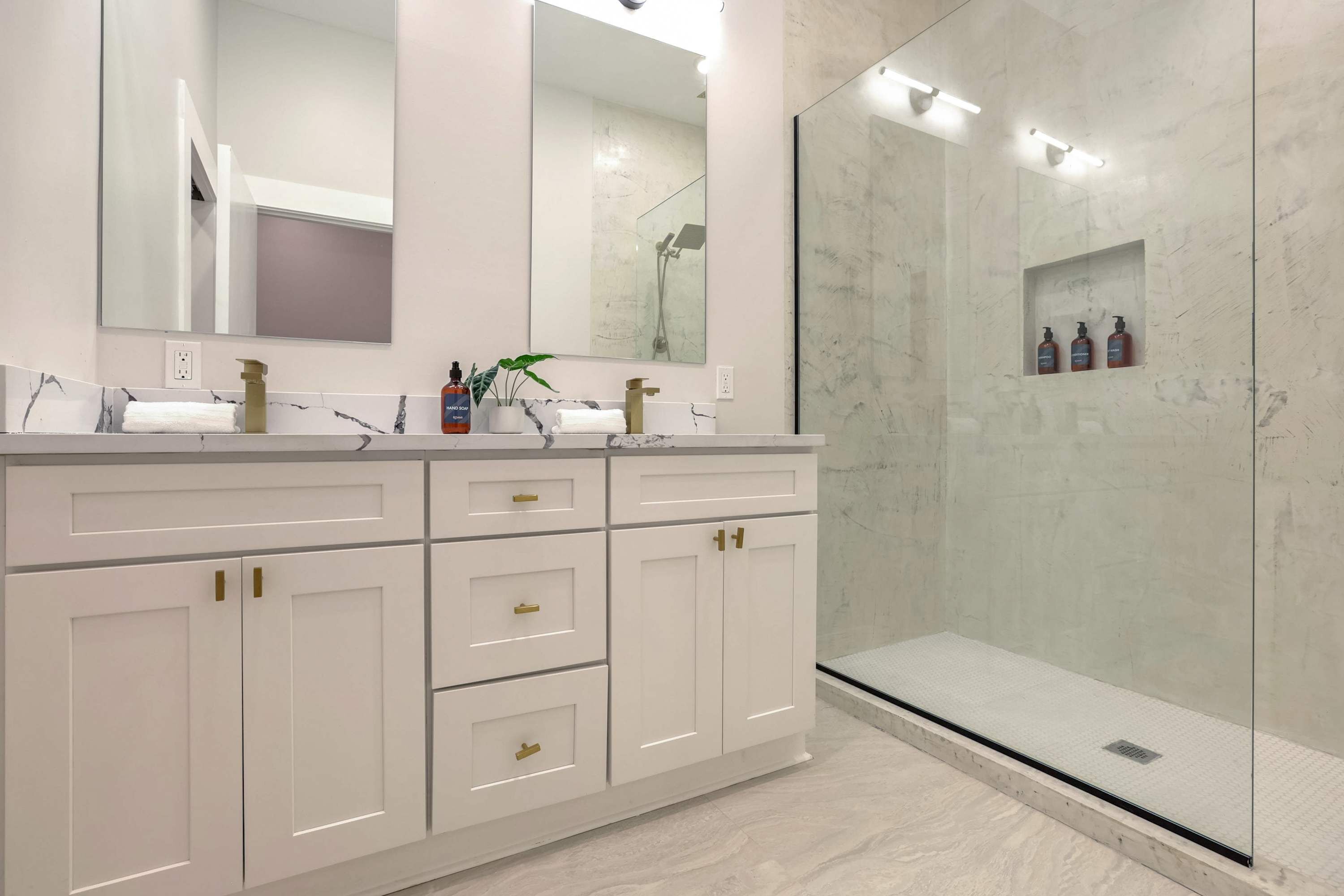 Shower, hair dryer, towels, shampoo