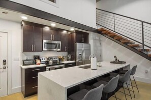 Fridge, stovetop, dishwasher, coffee/tea maker - Roami at Motorworks | 2-Story Apartment | 2BR (New Orleans)