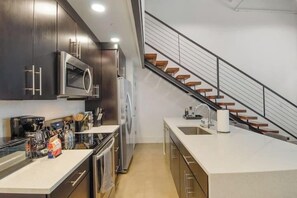 Fridge, stovetop, dishwasher, coffee/tea maker - Roami at Motorworks | 2-Story Apartment | 2BR (New Orleans)