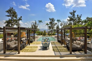 Outdoor pool, free pool cabanas, pool umbrellas