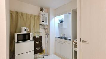 Fridge, microwave, cookware/dishes/utensils