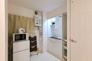 Fridge, microwave, cookware/dishes/utensils