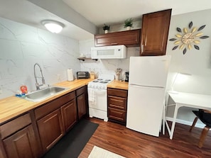 Fridge, microwave, stovetop, coffee/tea maker