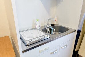 Fridge, microwave, electric kettle, cookware/dishes/utensils