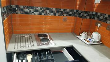 Luxury Studio Suite, City View | Private kitchen | Fridge, microwave