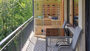 A wooden balcony with a view of a forested mountain range. - "Vacations on the sunny side of the Semmering in Breitenstein" (Niederösterreich)