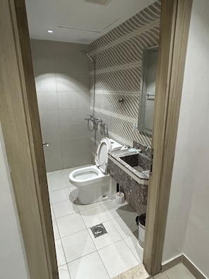 Shower, hair dryer, slippers, towels