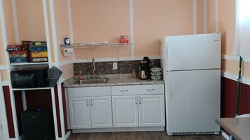 Fridge, microwave, coffee/tea maker, dining tables