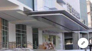 A modern building with a prominent sign. - The Beacon 1Br for 4, Tower 2, WiFi 300Mbps (Makati City)
