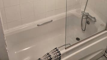 Combined shower/bathtub, deep-soaking bathtub, hair dryer, towels
