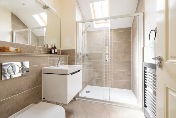 Shower, hair dryer, towels, soap