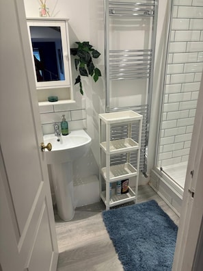 Combined shower/bathtub, deep-soaking bathtub, hair dryer, towels