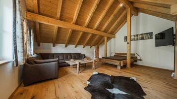 Comfort Penthouse, 2 Bedrooms, Balcony, Mountain View | Living area | 50-inch flat-screen TV with cable channels