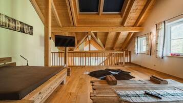 Comfort Penthouse, 2 Bedrooms, Balcony, Mountain View | Living area | 50-inch flat-screen TV with cable channels