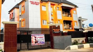 A multi-story apartment building with a sign indicating "Eagle Destiny Apartment." - Eagle Destiny Hotel and Apartment  (Asaba)