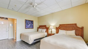 A hotel room with two beds, a ceiling fan, a painting, and a door. - Everglades Studio: Heated Pool Access, 15 Mi to NP (Naples)