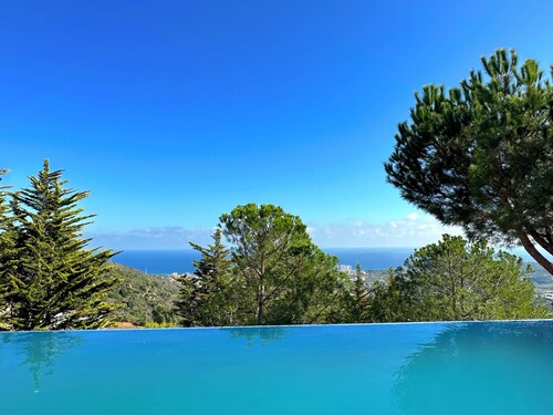 Architect-designed home with exceptional panoramic ocean views and an infinity pool
