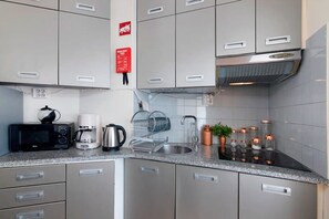 Fridge, microwave, stovetop, coffee/tea maker