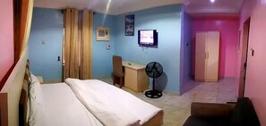 Deluxe Room, Balcony, City View | Desk, laptop workspace, blackout curtains, soundproofing