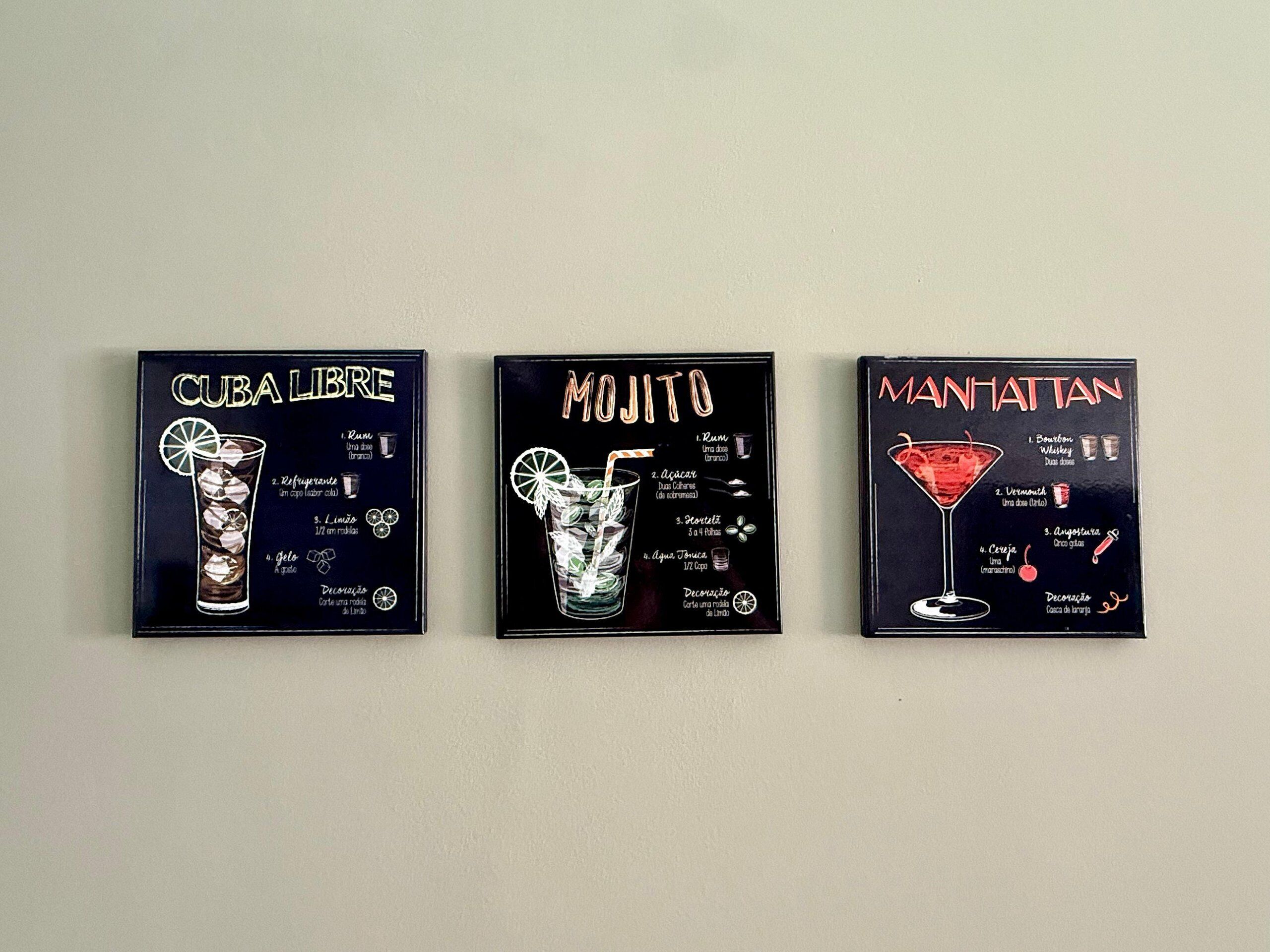 Three framed cocktail recipes: CUBA LIBRE, MOJITO, and MANHATTAN.