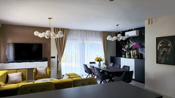 Villa (Four Bedroom Villa) | Living room | 32-inch flat-screen TV with satellite channels