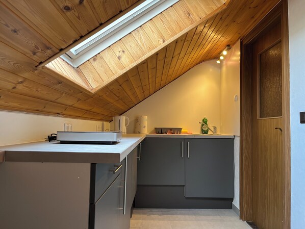 Microwave, stovetop, coffee/tea maker, electric kettle