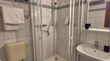 Shower, towels, soap, toilet paper