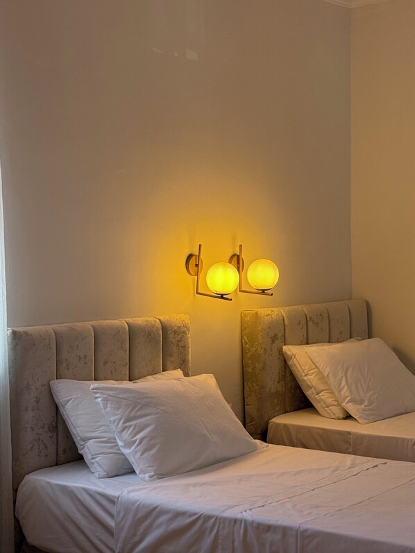 Standard Quadruple Room, City View | Desk, laptop workspace, blackout drapes, iron/ironing board
