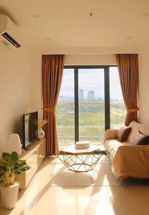 Habitación familiar, balcón, vistas a la ciudad | Zona de estar