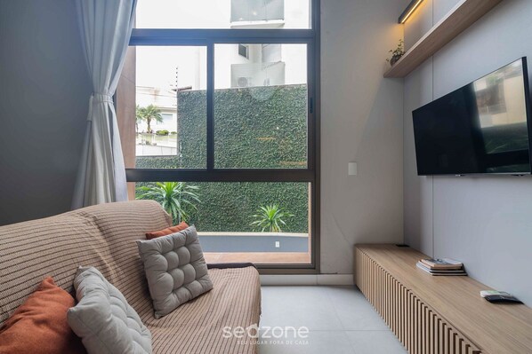 Basic Apartment | Living area | 40-inch TV with digital channels