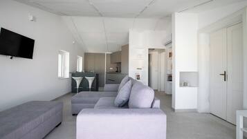 Apartment, 1 Bedroom, Sea View | Living area | 30-inch TV with satellite channels