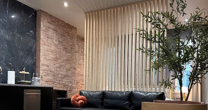 Free parking • KING bed • Stylish Brick Retreat