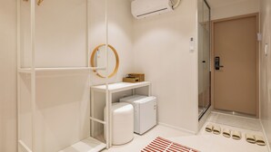A modern bathroom with a shower, toilet, and sink. - Slowon Hongdae (Seoul)