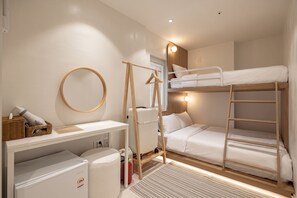 A bunk bed room with a desk, a hanging rack, and a radiator. - Slowon Hongdae (Seoul)