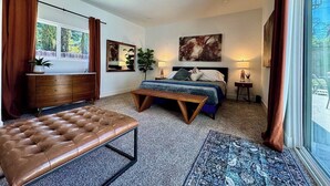 A bedroom with a bed, a bench, a dresser, a ceiling fan, and a window with curtains. - 4BR · Pool · Fenced Yard · Garage · Tree-Lined Street (Carmichael)