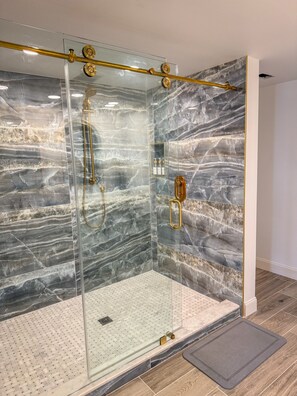 Shower, hair dryer, towels, soap