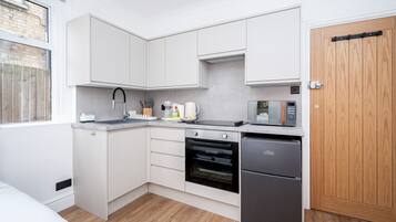 Fridge, microwave, oven, dining tables