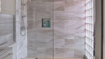 Shower, hair dryer, towels, soap