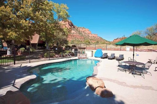 A cozy forest-side chalet with beautiful views of Sedona's red rocks.